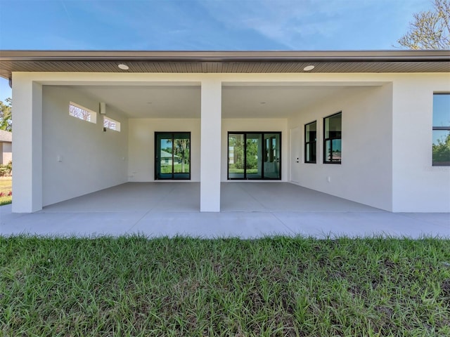 rear view of property featuring a patio