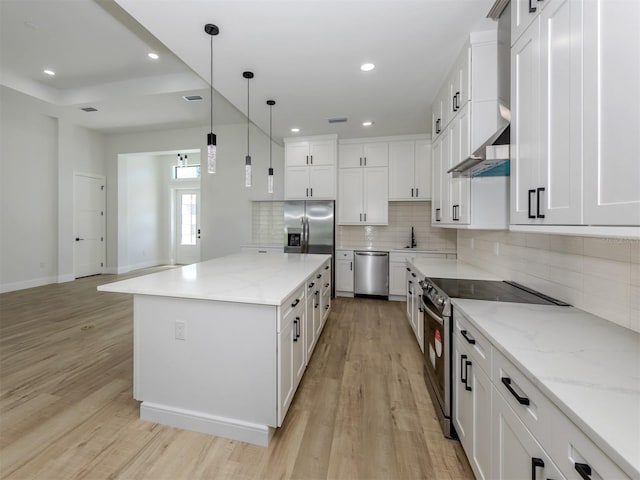 kitchen featuring white cabinets and light wood-type flooring