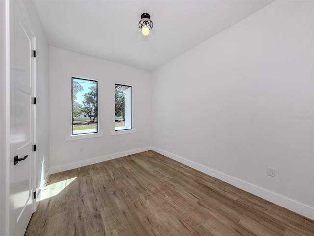 empty room featuring dark wood-type flooring