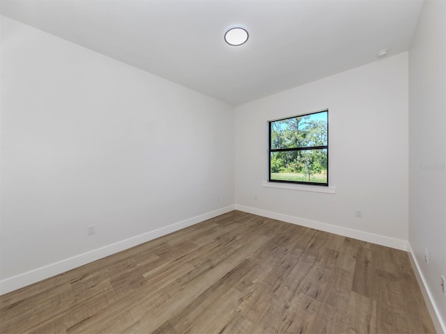 spare room with light wood-type flooring