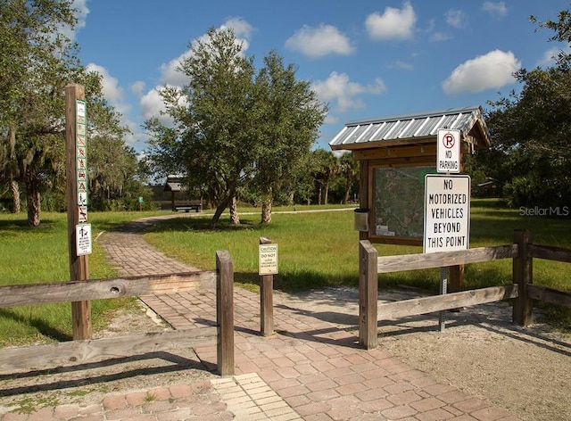 surrounding community featuring a lawn