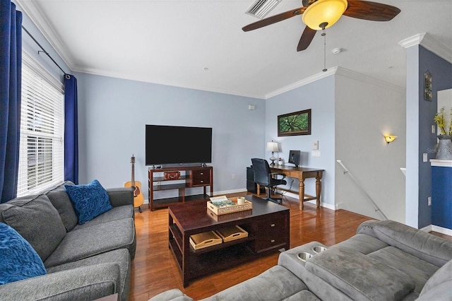 living room featuring ceiling fan, ornamental molding, and dark hardwood / wood-style flooring