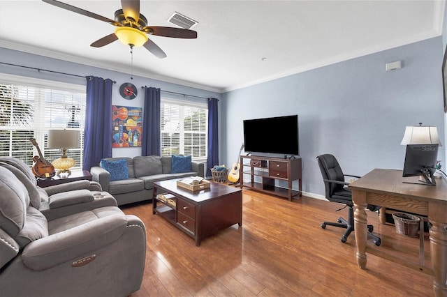 living room with ceiling fan, dark hardwood / wood-style flooring, and ornamental molding