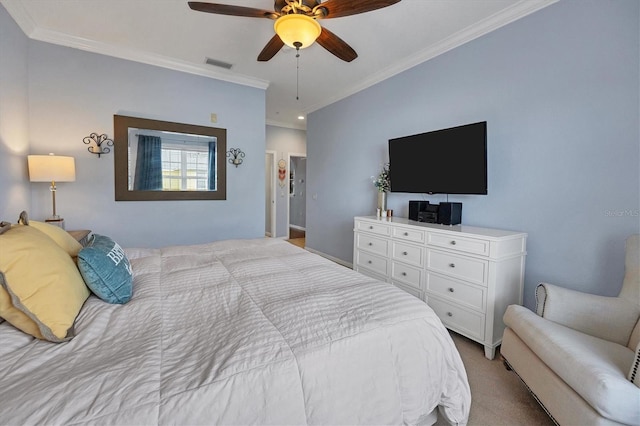 bedroom featuring light colored carpet, ornamental molding, and ceiling fan