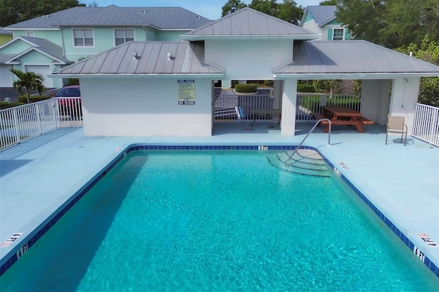 view of swimming pool featuring a patio and a gazebo