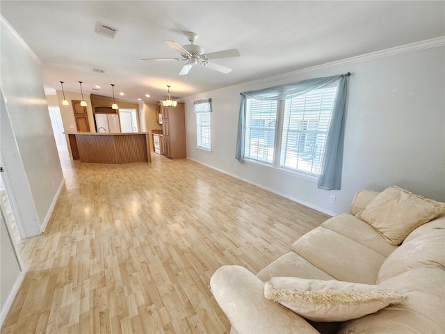 living room featuring light wood-type flooring, ornamental molding, and vaulted ceiling