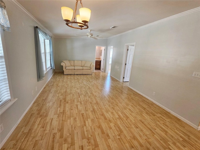 unfurnished living room with ceiling fan with notable chandelier, light wood-type flooring, and crown molding