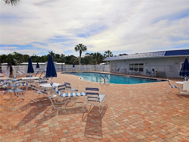 view of pool featuring a patio