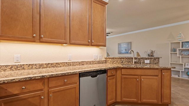 kitchen featuring light stone countertops, ornamental molding, sink, light tile floors, and stainless steel dishwasher