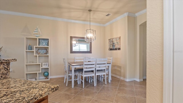 tiled dining area with crown molding and a chandelier