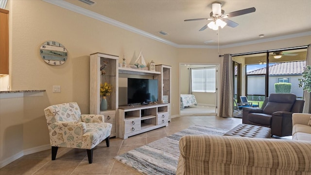 living room with crown molding, ceiling fan, and light tile floors