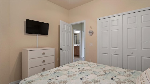 bedroom featuring a closet and tile floors