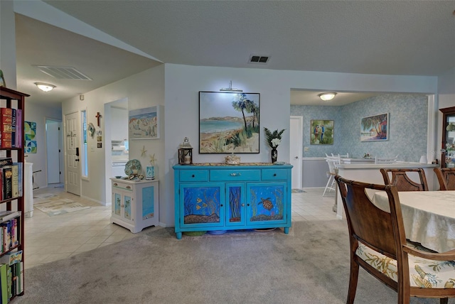 dining room featuring light carpet