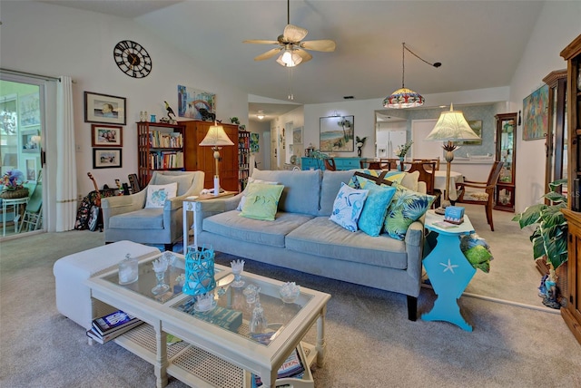 living room with lofted ceiling, ceiling fan, and light carpet