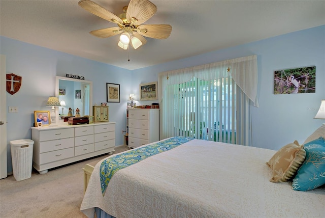 bedroom with light carpet and ceiling fan