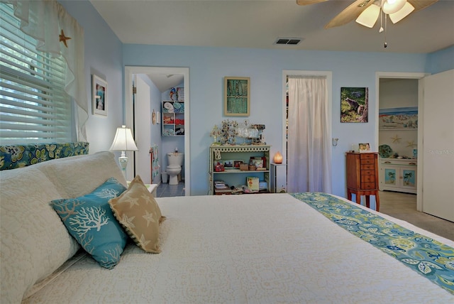 bedroom featuring ensuite bath and ceiling fan