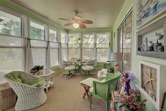 sunroom / solarium with ceiling fan