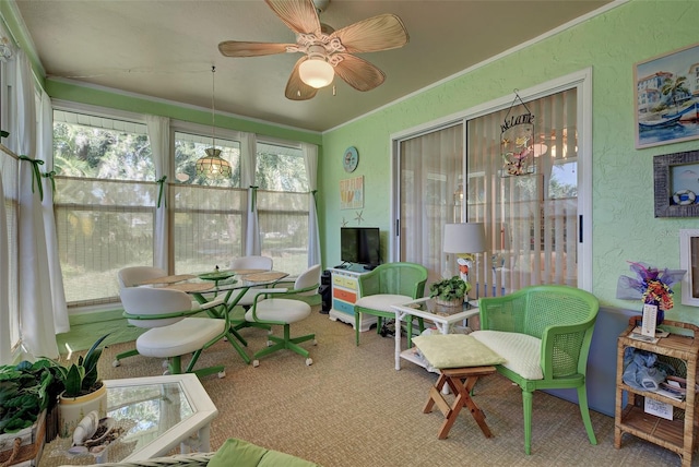 sunroom with plenty of natural light and ceiling fan