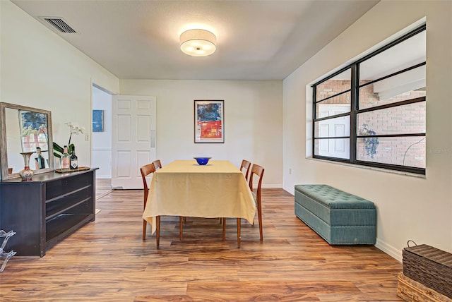 dining area featuring wood-type flooring