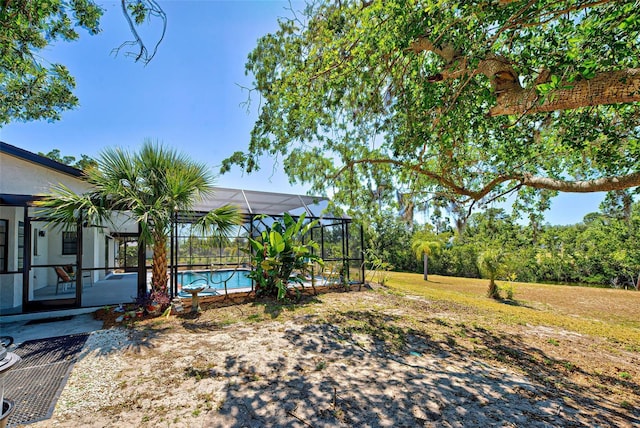 view of yard featuring a lanai