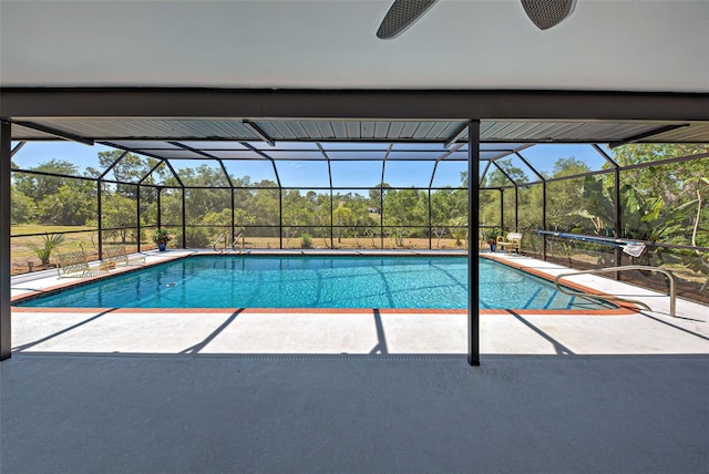 view of pool with a lanai and a patio area