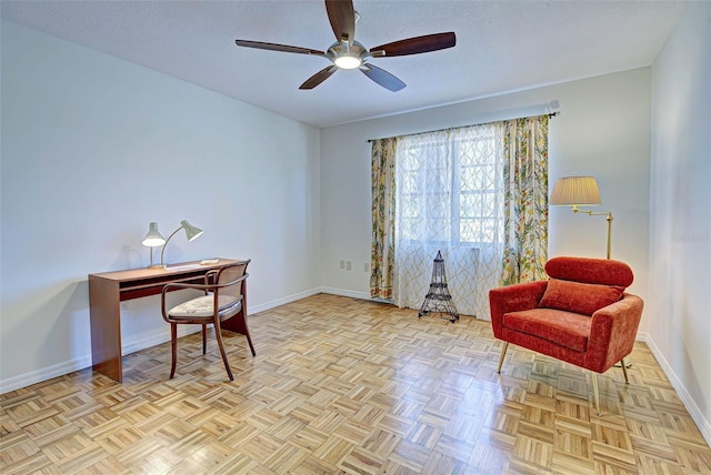 office with ceiling fan, light parquet flooring, and a textured ceiling