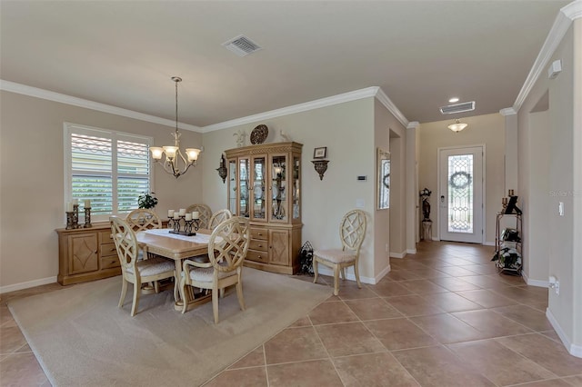 tiled dining space featuring a chandelier and crown molding