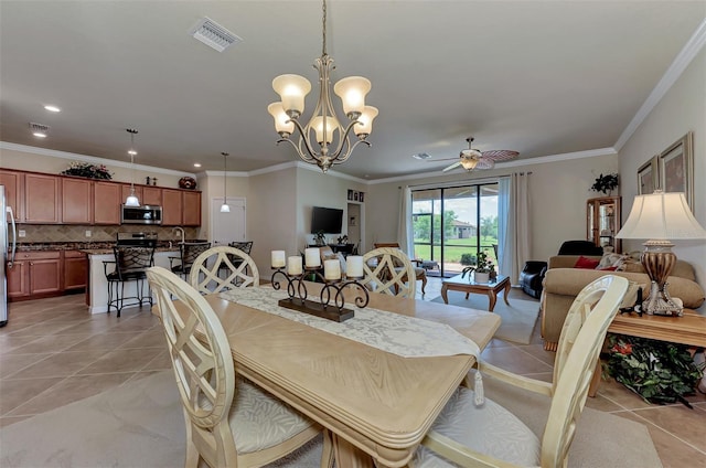 tiled dining room with ornamental molding and ceiling fan with notable chandelier