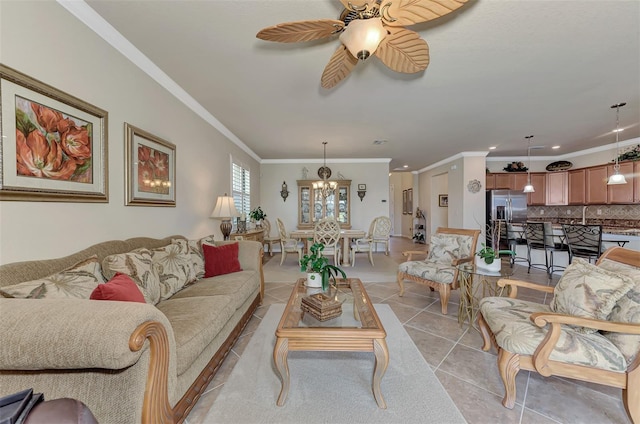 living room featuring ornamental molding, ceiling fan with notable chandelier, and light tile floors