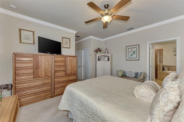 bedroom featuring ceiling fan, crown molding, ensuite bathroom, and carpet flooring