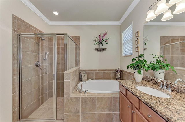 bathroom featuring large vanity, crown molding, and separate shower and tub