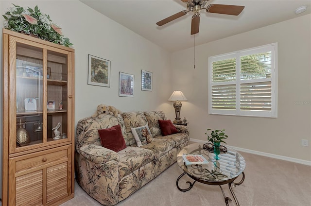 living room featuring ceiling fan and light carpet