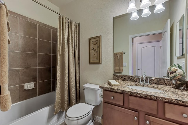 full bathroom featuring vanity with extensive cabinet space, shower / bath combination with curtain, and toilet