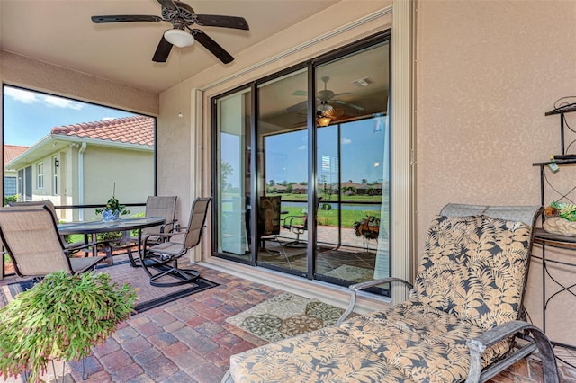 view of terrace featuring ceiling fan