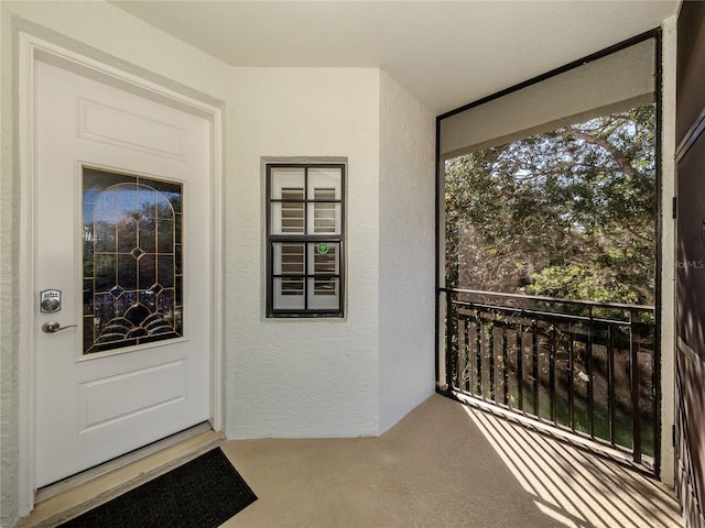 entrance to property with a balcony