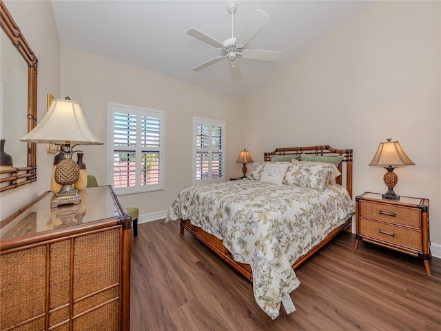 bedroom with ceiling fan and dark hardwood / wood-style floors