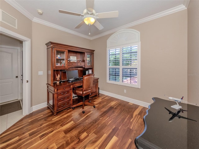 home office with ceiling fan, dark hardwood / wood-style floors, and crown molding