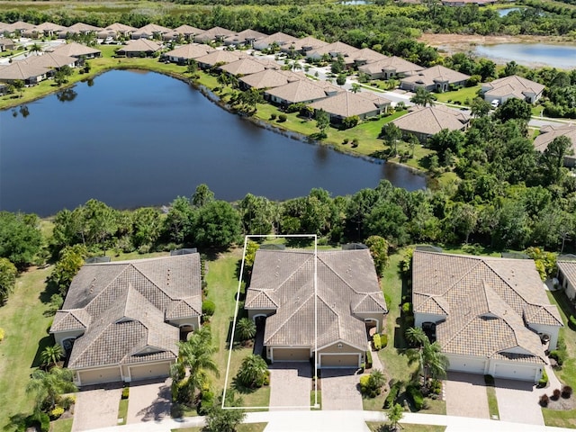 drone / aerial view with a water view