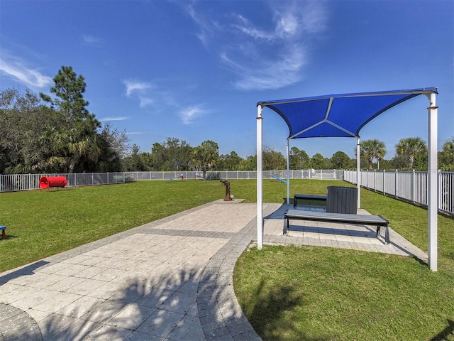 surrounding community featuring a patio and a yard