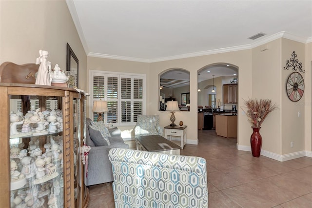 living room with tile patterned flooring and crown molding