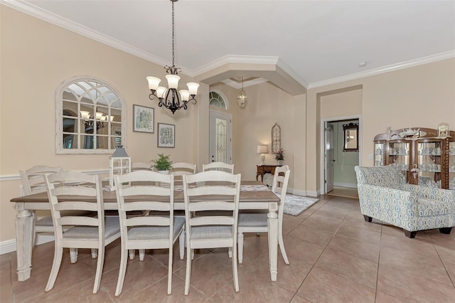 dining space with crown molding, a notable chandelier, and tile patterned floors