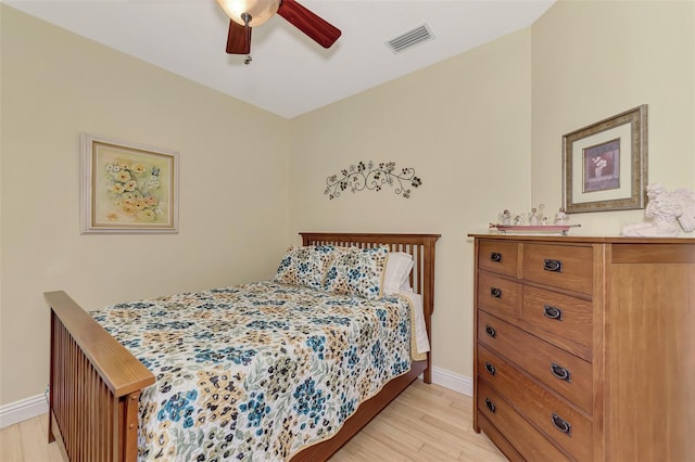 bedroom with ceiling fan and light hardwood / wood-style flooring