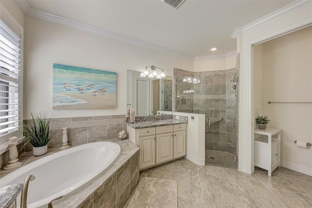 bathroom featuring vanity with extensive cabinet space, separate shower and tub, tile floors, and a wealth of natural light