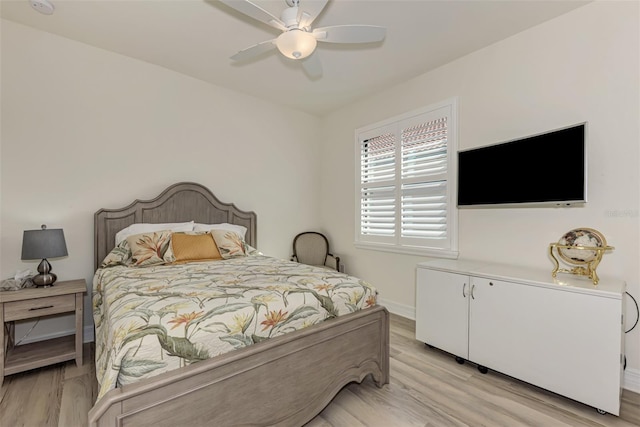 bedroom featuring light hardwood / wood-style flooring and ceiling fan