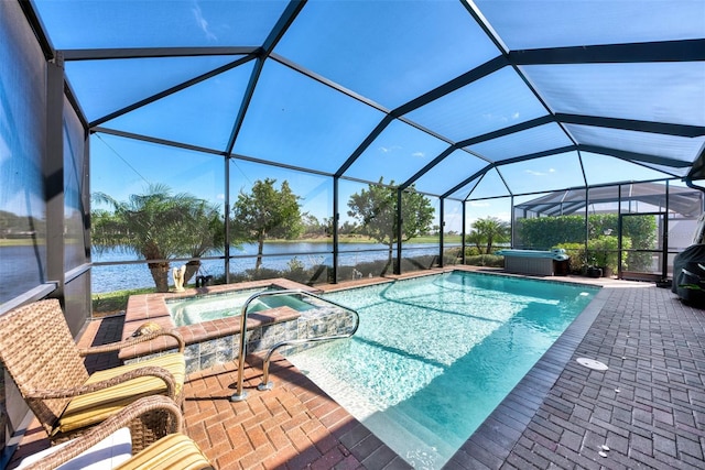 view of swimming pool with a patio, glass enclosure, and an outdoor hot tub