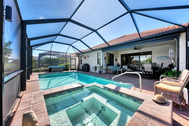 view of swimming pool featuring a patio, an outdoor living space, a lanai, an in ground hot tub, and ceiling fan