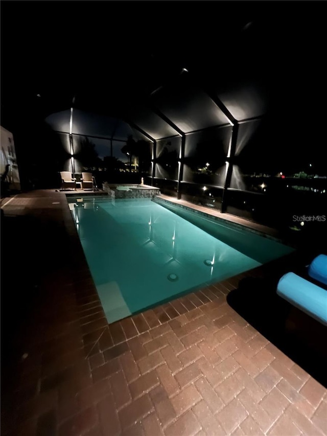 view of pool at night