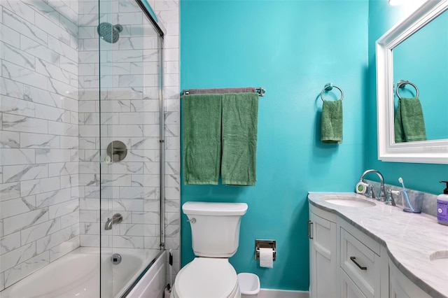 full bathroom with vanity, toilet, and bath / shower combo with glass door