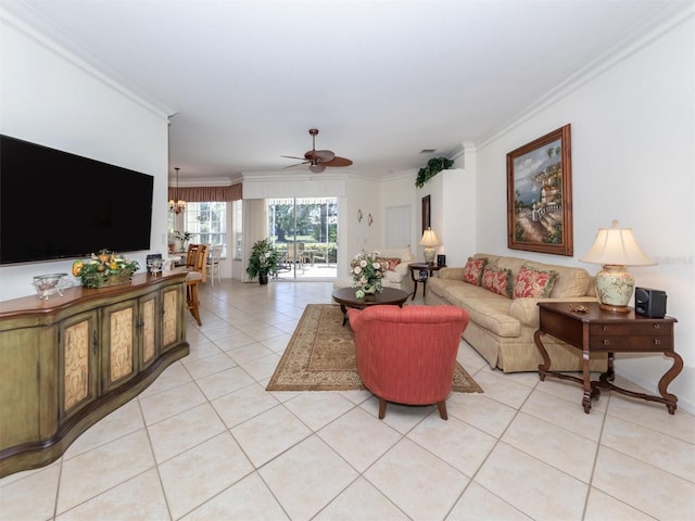 tiled living room with ornamental molding and ceiling fan with notable chandelier