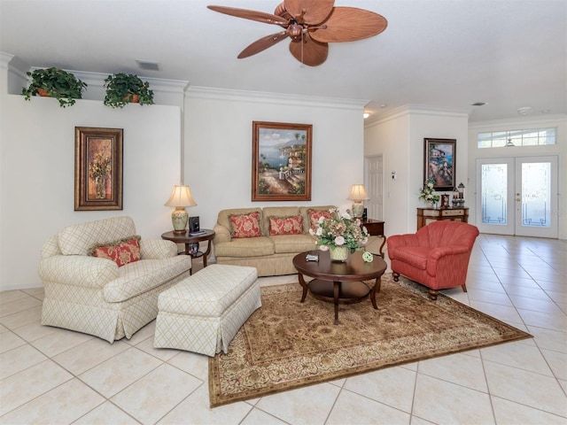 tiled living room with crown molding, ceiling fan, and french doors